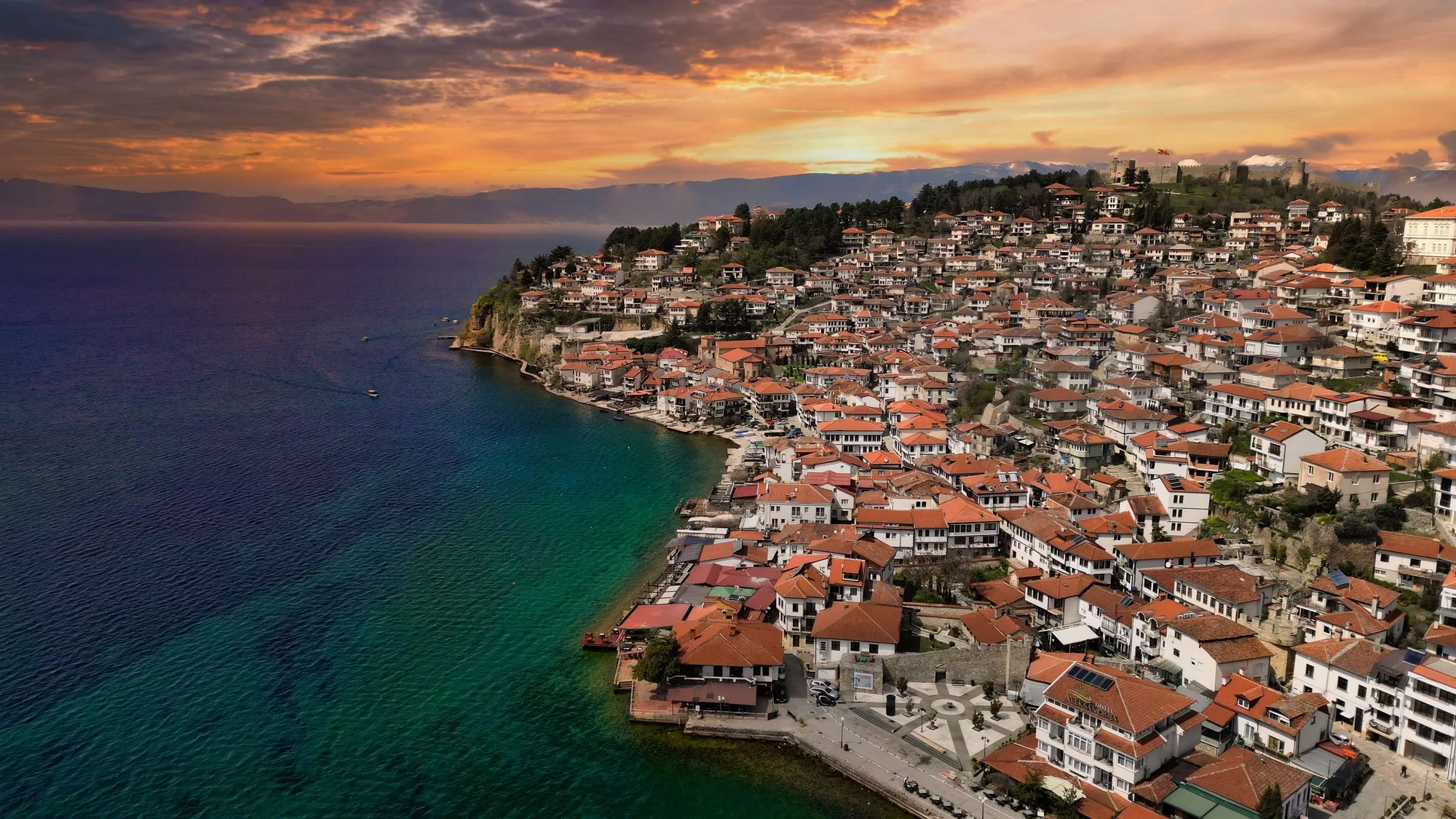Aerial view of Lake Ohrid and the town at sunset with vibrant colors in the sky. Macedonia.