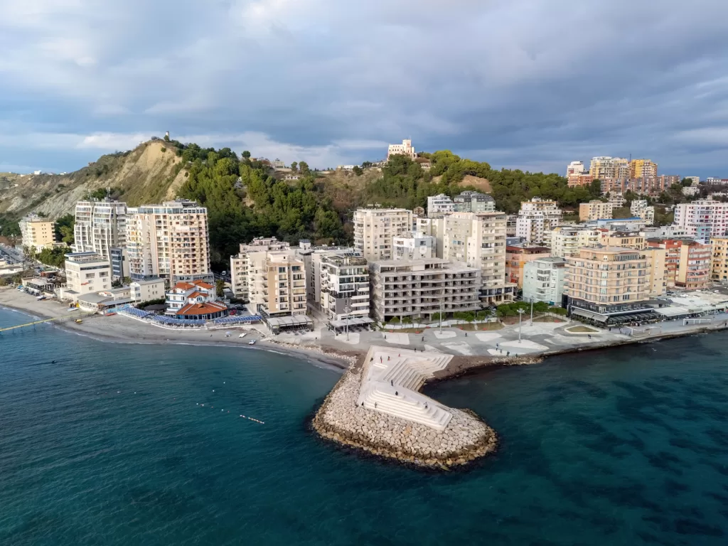 Aerial view of the coastal cityscape with modern buildings by the sea in Durres, Albania