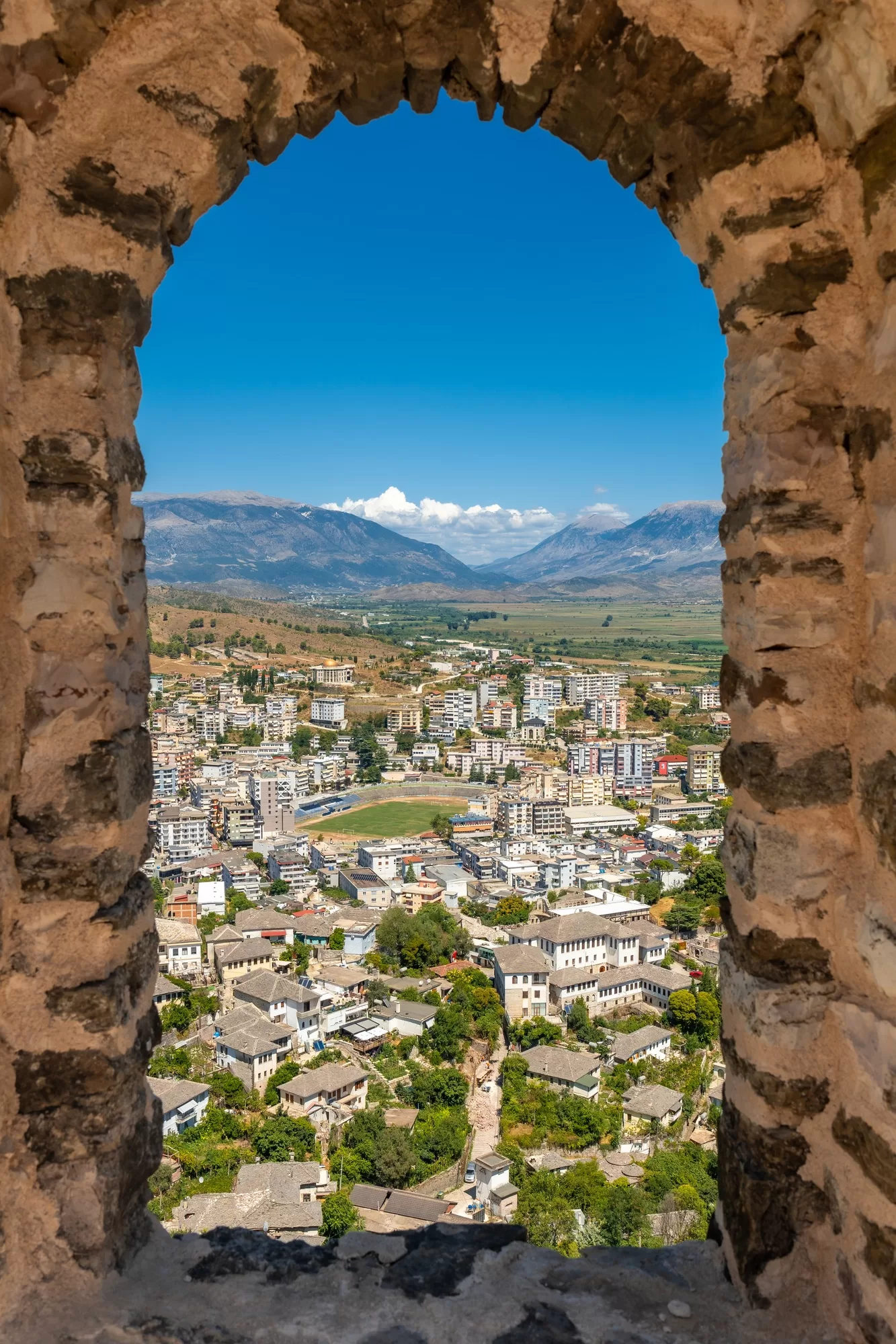 Looking over the city from a window of the Ottoman Castle Fortress of Gjirokaster or Gjirokastra