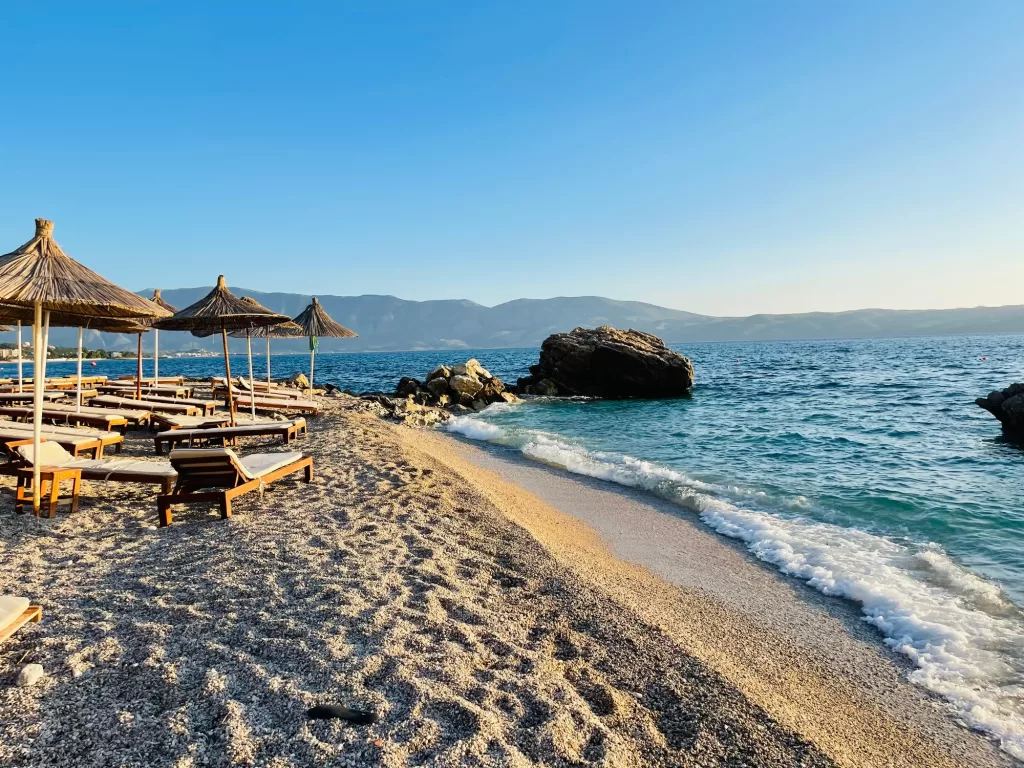 Rocky beach and crystal turquoise water of Ionian Sea in Albania.